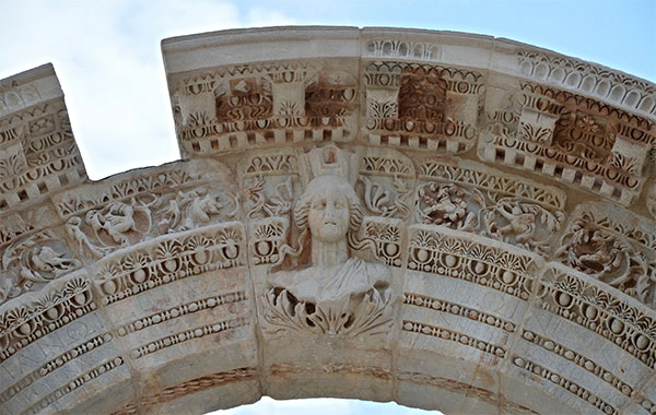 curved arch decorated with floral patterns and bearing a relief of Tyche, the goddess of victory, Temple of Hadrian, Ephesus