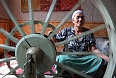 Woman spinning silk thread (Photo credit: Adam Jones)