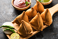Indian style Samosas served with green and red chutney
