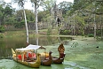 Mossy water and boats outside gate to Angkor Thom, Siem Reap